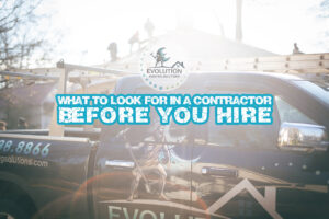 A company truck is parked as a new roof is being installed